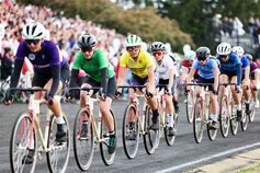 A group of riders competes in the Women's Little 500 race at Bill Armstrong Memorial Stadium.